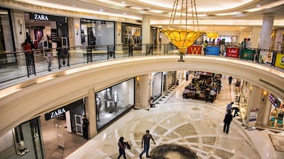 Shoppers walk past a Zara store inside the DLF Promenade shopping mall in New Delhi. Graham Crouch / Bloomberg News