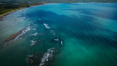 An oil slick from the sunken tanker MT Princess Empress mars the shoreline in Pola, the Philippines. Getty Images