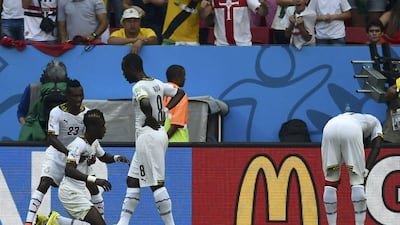 John Boye, second left, is consoled by teammates after scoring an own goal on Thursday against Portugal at the 2014 World Cup in Brasilia, Brazil. Dylan Martinez / Reuters