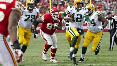 Aaron Rodgers, with the ball, has been sacked seven times in two games and taking big hits.