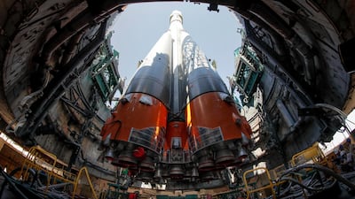 Russia's Soyuz-FG booster rocket with the attached Soyuz MS-13 spacecraft is mounted vertical at the launch pad at the Baikonur Cosmodrome in Kazakhstan in July 2019. Variants of the Soyuz craft have taken cosmonauts to space since 1967. Dmitri Lovetsky / Reuters