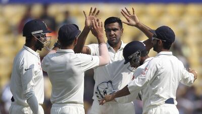 Ravichandran Ashwin, centre, took five wickets to help reduce South Africa to their lowest ever Test innings score. Rafiq Maqbool / AP Photo