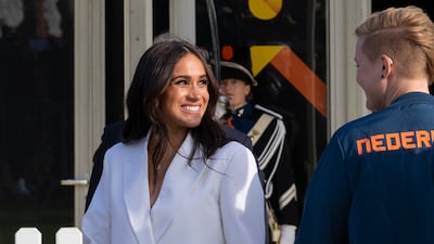 Meghan, Duchess of Sussex, arrives at the Invictus Games venue in The Hague, the Netherlands, in a white Valentino suit. AP