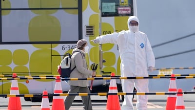 A passenger of the Diamond Princess cruise ship leaves the Daikoku Pier Cruise Terminal in Yokohama. EPA