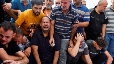 Palestinian mourners during the funerals of Al-Agha family members killed in Israeli strikes in Khan Younis in the southern Gaza Strip. Reuters