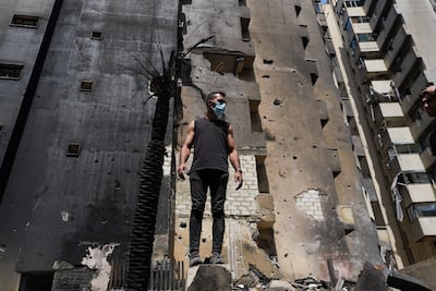 A man works at the site of an Israeli strike on a residential building in Beirut. Getty Images