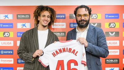 Hannibal Mejbri, left, alongside Sevilla sports director Victor Orta as the midfielder is officially unveiled as a Sevilla player. EPA