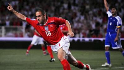 Joe Cole celebrates after scoring against Andorra.