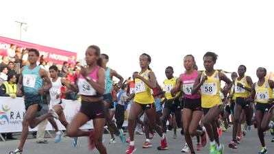 Elite runners from Africa lead the way at the start of the Ras Al Khaimah Half Marathon. Jeffrey E Biteng / The National