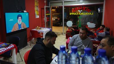 Lebanese men listen to Secretary-General of Hezbollah Sayyed Hassan Nasrallah during his speech on Al-Manar TV screen where he spoke about the latest political developments in Lebanon at a coffeshop in Beirut. EPA
