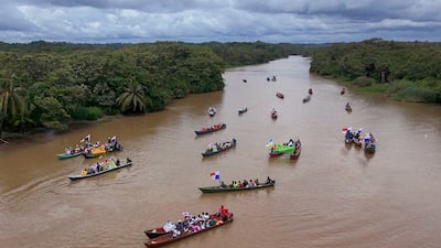 Demonstrators travel by river to the mouth of the Rio Indio on Panama's Caribbean coast to protest against a planned reservoir for the Panama Canal and Panamanian President Jose Raul Mulino. AP Photo