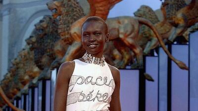 2005: Alek Wek in a Valentino gown embroidred with the word 'peace' in many languages. Photo: Getty