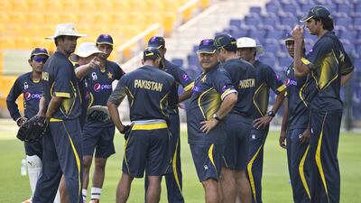 The Pakistan team practises at the Zayed Cricket Stadium under supervision of Dav Whatmore, centre. Antonie Robertson / The National