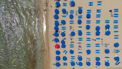 Tourists sunbathing in Benidorm, Spain. Getty