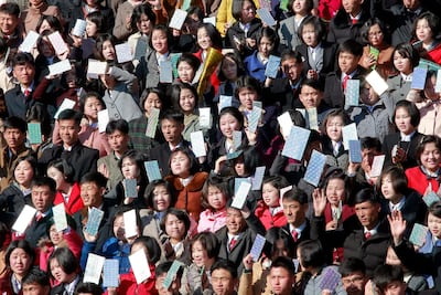 North Korean audience cheer runners during the 30th Mangyongdae Prize International Marathon in Pyongyang, North Korea on Sunday. AP