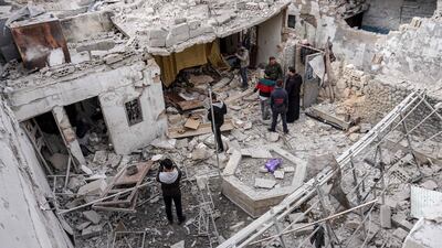 Syrians inspect damage from a reported regime air strike on civilian residences in the town of Saraqib in the northern Idlib province on March 10. AFP