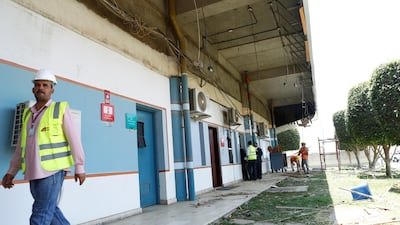 Workers tend to the damaged parts of Saudi Arabia's Abha airport. Reuters