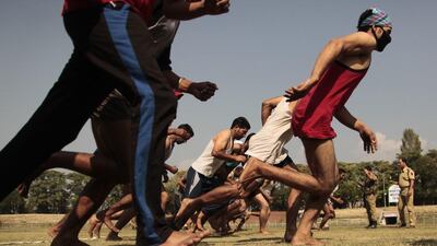 Kashmiris take a fitness test during a police recruitment drive Indian-controlled Kashmir. Mukhtar Khan / AP Photo