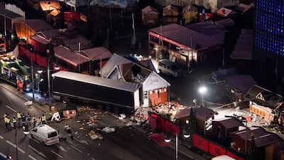 Workers secure the lorry involved in the Berlin Christmas market attack to a recovery vehicle on December 20, 2016. Bernd Von Jutrczenka/EPA