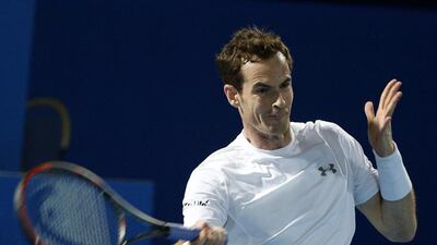 Andy Murray of Singapore Slammers hits a return to UAE Royals leader Roger Federer of UAE Royals during their men's singles match at the International Premier Tennis League in Dubai on Tuesday. Karim Sahib / AFP