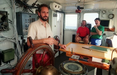 FILE-This Aug. 29, 1991, file photo shows Tommy Thompson in August 1991, with (seated) chief scientist Bob Evans and Barry Schatz, right, in the control room of the 'Artic Discover'. Mr Thompson found the 'SS Central America' in 1988. AP / The Columbus Dispatch