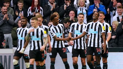 Newcastle's Alexander Isak, second right, celebrates after scoring. PA