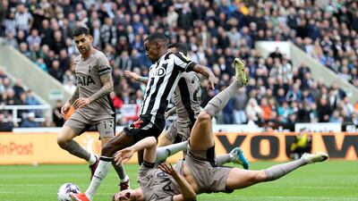 Alexander Isak of Newcastle United scores his team's first goal as Micky van de Ven of Tottenham Hotspur loses his footing. Getty Images