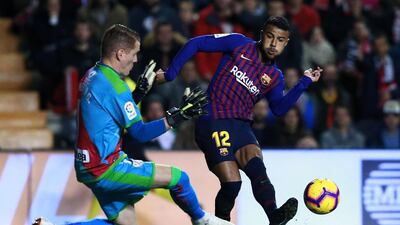 Barcelona's Rafinha is challenged by Rayo Vallecano's David Cobeno. Getty Images