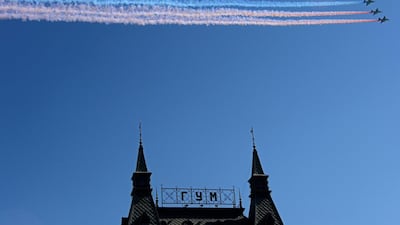 Russian Sukhoi Su-25 ground-attack aircraft release smoke in the colours of the Russian flag while flying above the Red Square in Moscow during a Victory Day parade. Kirill Kudryavtsev / AFP