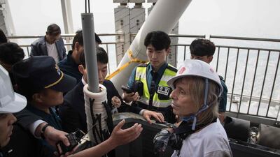 "I climbed about 75 stories and then after that, it was a bit like cat and mouse," Mr Robert said. "Finally, I decided to surrender." Ed Jones / AFP