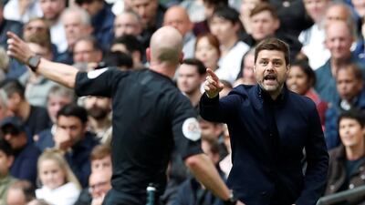 Tottenham manager Mauricio Pochettino talks to referee Taylor. Reuters