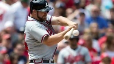 Atlanta Braves’ Evan Gattis hits a two-run home run against the Washington Nationals.