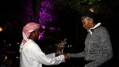 Venus Williams is shown a falcon at the player's party on Tuesday. Warren Little / Getty Images