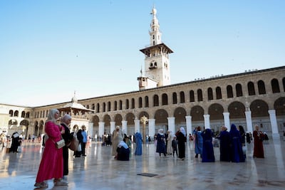 People gather in the courtyard of Umayyad Mosque. Reuters