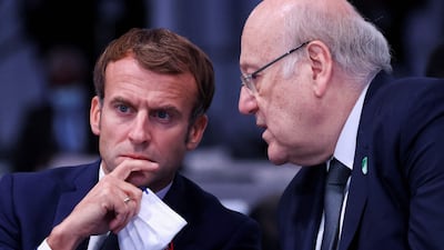 Lebanon's Prime Minister Najib Mikati speaks with France's President Emmanuel Macron during Cop26 in Glasgow. AFP