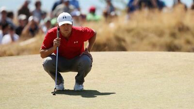 Jordan Spieth lines up a putt on the third green. Mike Ehrmann / Getty Images / June 20, 2015