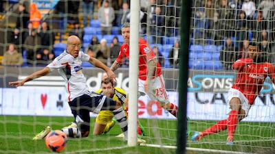 Cardiff City's Fraizer Campbell, right, scores the opening goal during the FA Cup fourth round match between Bolton and Cardiff City on Saturday. Andrew Yates / AFP