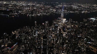 The Lower Manhattan area of New York City is lit up at dusk. AFP