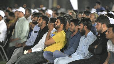 Labourers enjoy the performances. Khushnum Bhandari for The National