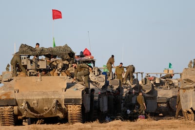 Israeli soldiers on the Gaza border on Thursday. Reuters
