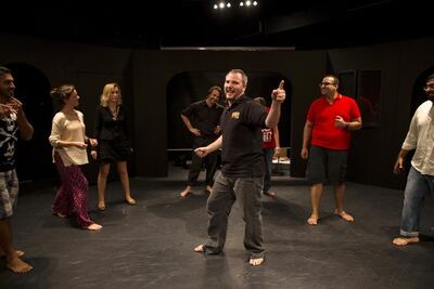 Artistic director Kemsley Dickinson leads an improv workshop in Courtyard Playhouse. Christopher Pike / The National