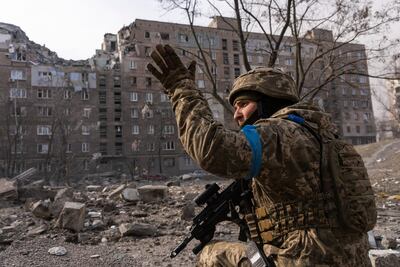 A Ukrainian serviceman guards his position in Mariupol. AP Photo