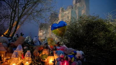 Candles burn at a makeshift memorial in Ternopil, Ukraine, where an apartment building was hit by a Russian missile. Reuters