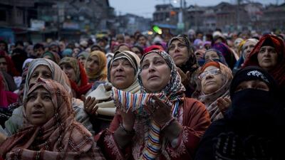Kashmiri Muslims pray outside the shrine of Sufi Saint Syed Abdul Qadir Jilani in Srinagar. Dar Yasin / AP Photo