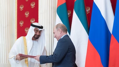 Sheikh Mohammed bin Zayed, Crown Prince of Abu Dhabi and Deputy Supreme Commander of the UAE Armed Forces (left) and Vladimir Putin, President of Russia (right) exchange documents after the signing of a memorandum of understanding, at the Kremlin Palace. Rashed Al Mansoori / Crown Prince Court - Abu Dhabi