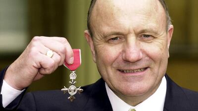 Former England footballer George Cohen at Buckingham Palace with his MBE. PA