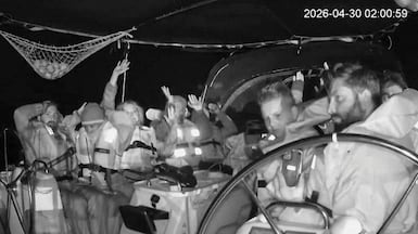 Crew members of the Global Sumud Flotilla surrender to Israeli troops off the coast of Greece on Wednesday night. Reuters