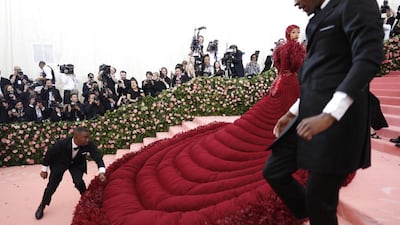 CARDI B, MAY 2019: A gown that requires two personal assistants deserves some attention. This giant stylish sleeping bag is filled with down (comfy) and was designed by Thom Browne. EPA