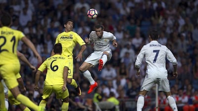 Real Madrid’s Gareth Bale, top right, goes for a header with Villarreal’s Jose Angel Valdes, top left. Francisco Seco / AP Photo