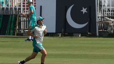 Australia's captain Pat Cummins warms up during a practice session at the Rawalpindi Cricket Stadium. AFP